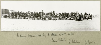 Bedouin women waiting to draw their ration of water, Beni Saleh, July 1917 by Capt. Arthur Rhodes